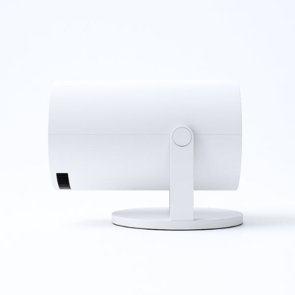 The Projection Rooms Spotlight Projector, a sleek white cylindrical device, is shown on a round base. It offers HD quality wireless streaming and is displayed in a side view against a plain white background.