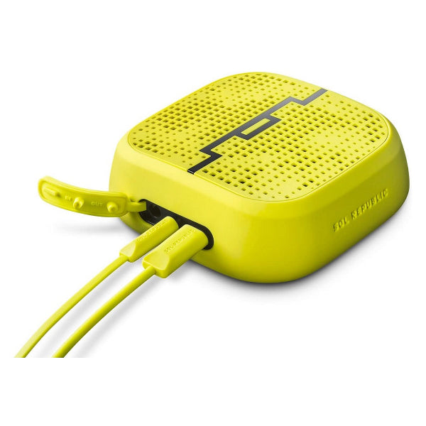 The SOL Republic Punk Wireless Pocket Speaker, by The Projection Room, is a yellow Bluetooth speaker with a sleek pocket design and perforated top surface. Two cords connect to the side, highlighting its durability and water resistance.
