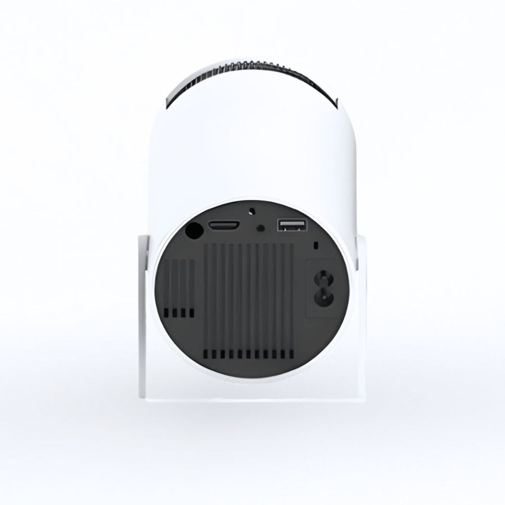 The Projection Room’s Spotlight Projector is shown from the back with a rounded, modern design and a circular black panel featuring micro SD, HDMI, USB, and power input ports—perfect for wireless streaming.