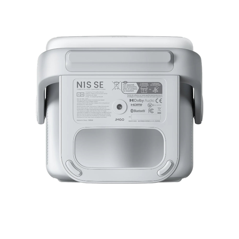 A close-up of the bottom of the white JMGO N1S SE projector shows Dolby Audio, HDMI, and Bluetooth logos, technical details, a central screw hole, and JMGO branding.