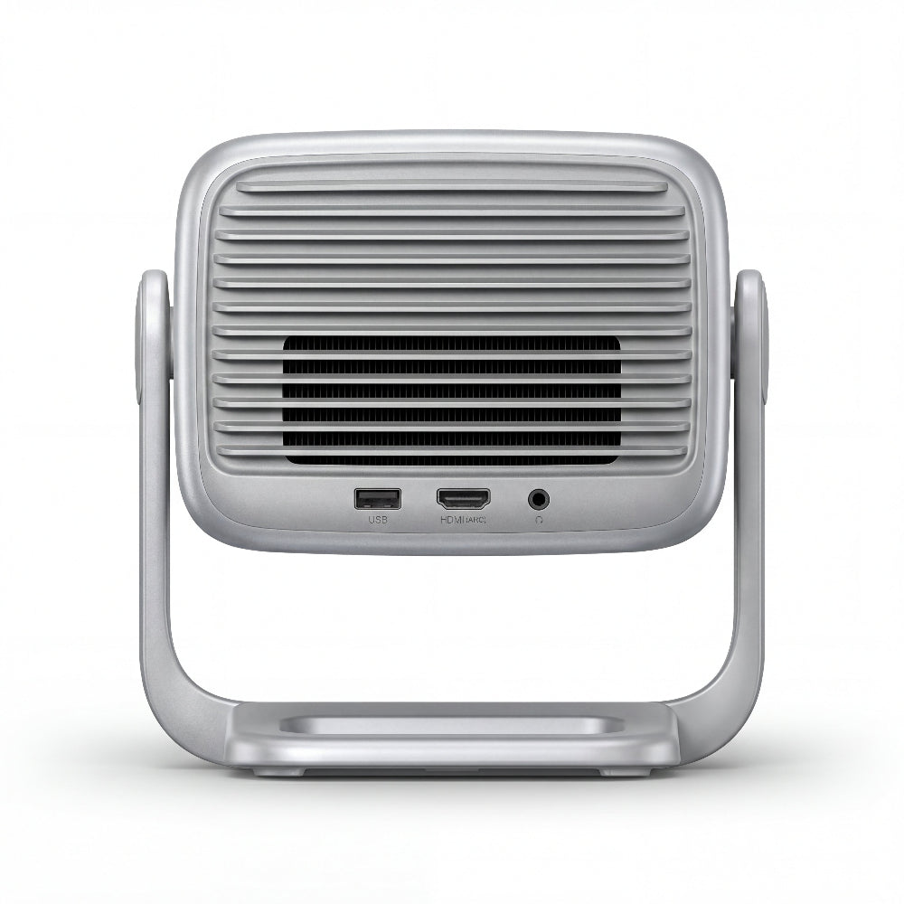 The JMGO N1S SE by JMGO is a silver Full HD projector viewed from the back, featuring horizontal ventilation grills, USB, HDMI, and DC input ports, all supported by a U-shaped stand on a white background.