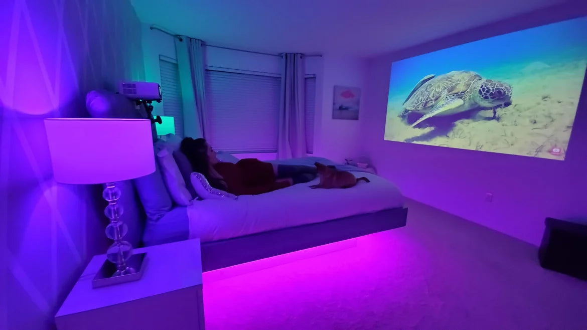 mini portable projector on wall in the bedroom