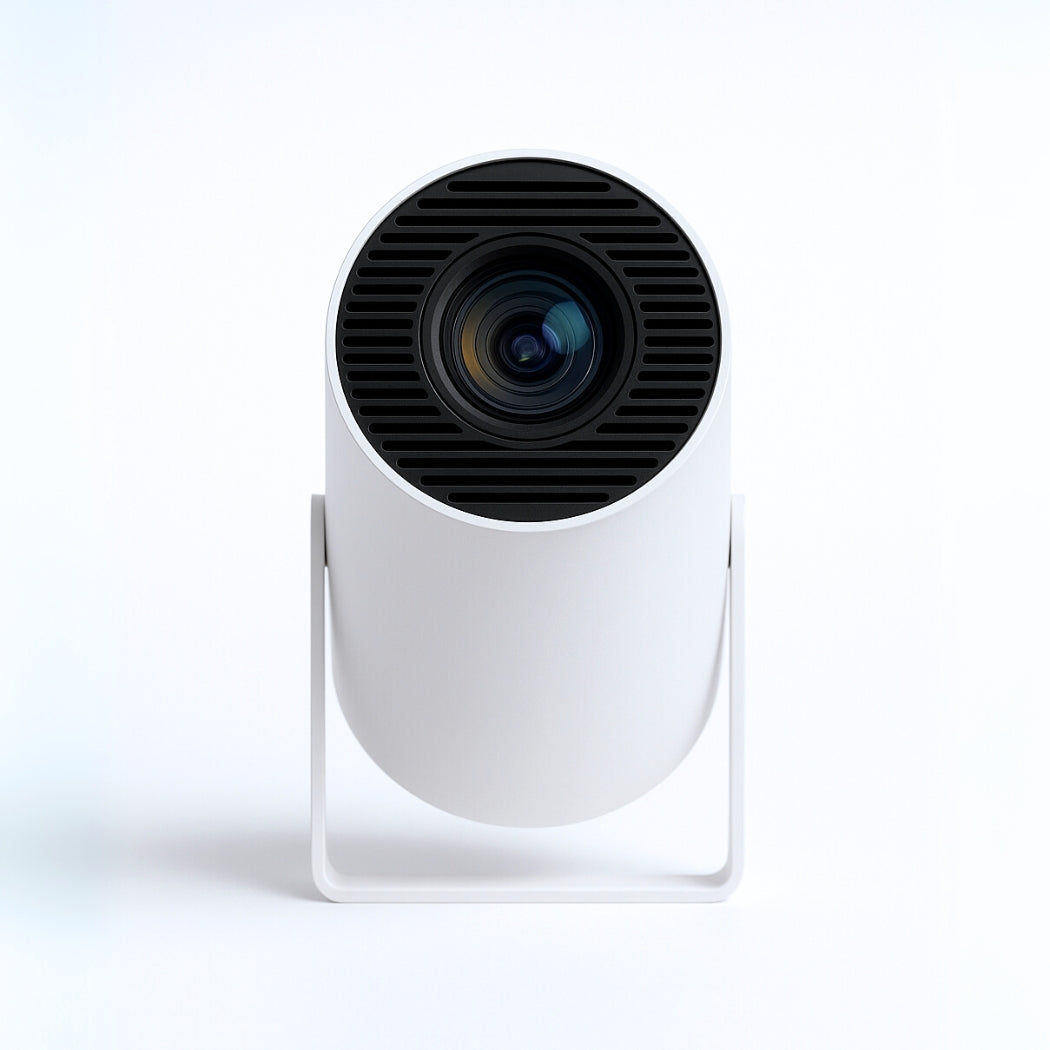 The Spotlight Projector by The Projection Room features a sleek, cylindrical white design with a forward-facing black lens on a minimalist stand—ideal for portable entertainment against any backdrop.
